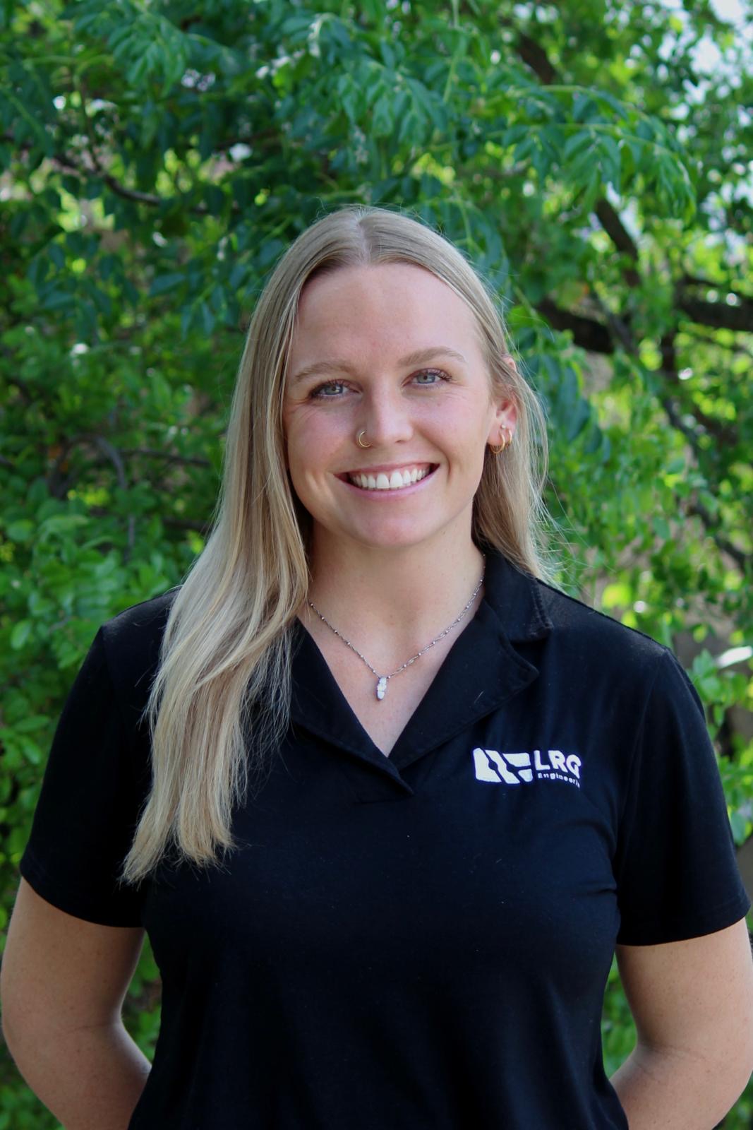 Lauren Rein, P.E. outdoors in an LRG Engineering shirt